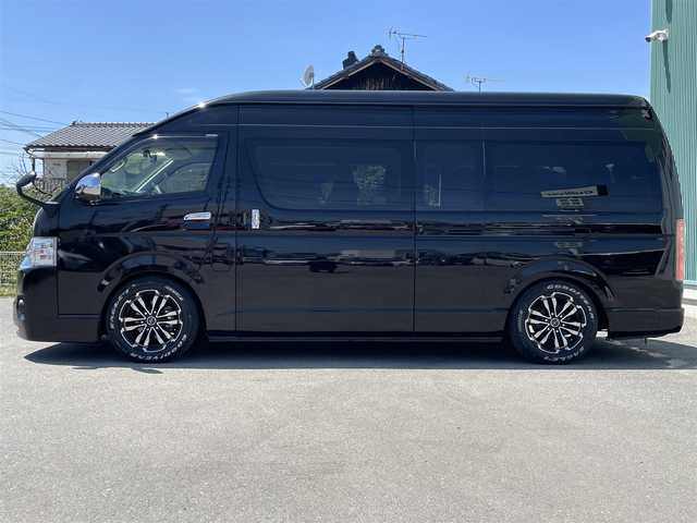 トヨタ ハイエース グランドキャビン 福岡県 2019(平31)年 1.5万km ブラック 4列10人乗り/純正ナビ(BT/CD/DVD)/フルセグTV/パワースライドドア(片側)/バックカメラ/ビルトインETC2.0/ドライブレコーダー/後席用フリップダウンモニター/ビークルスタビリティコントロール/電動格納ドアミラー/オートライト/オートエアコン/ハンドルカバー付/レザー調シートカバー付/2～4列目ベンチシート/シャレン17インチアルミホイール/スマートキー/スマートエントリー/スタートシステム