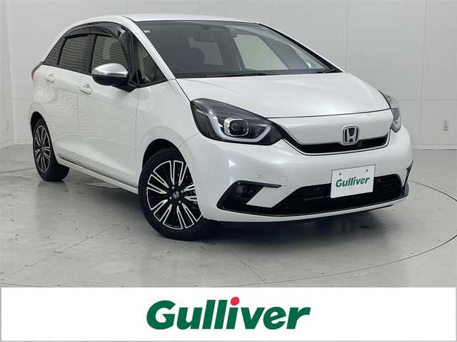 ホンダ フィット e:HEVリュクス 茨城県 2020(令2)年 0.7万km プラチナホワイトパール 純正9型ナビ/バックカメラ/フルセグ/衝突被害軽減ブレーキ/車線逸脱抑制装置/レーダークルーズコントロール/オートマチックハイビーム/クリアランスソナー/ETC/ドラレコ/シートヒーター/ステアリングヒーター/純正16インチAW/LEDヘッドライト/スマートキー