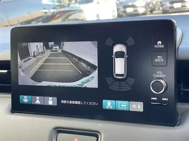 ホンダ ヴェゼル ハイブリッド e:HEV Z 東京都 2025(令7)年 0.1千km プラチナホワイトパール 登録済未使用車　/純正ナビ　/置型充電　/ＢＳＭ　/レーダークルーズコントロール　/１８インチ純正ホイール　/純正ＬＥＤ/左右独立温度コントロール式フルオートエアコンディショナー　/電動リアゲート　/シートヒーター　/衝突被害軽減ブレーキ　/盗難防止装置/Honda　SENSING/マルチビューカメラシステム/後退時連動ドアミラー/ＥＴＣ２．０　