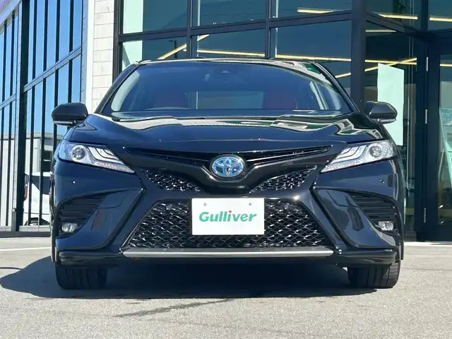トヨタ カムリ WS ブラックエディション 愛媛県 2020(令2)年 6.8万km プレシャスブラックパール 純正8型ディスプレイオーディオ(フルセグTV/Bluetooth)/バックカメラ/赤レザーシート/前席シートヒーター/パワーシート/トヨタセーフティセンス/衝突被害軽減装置/車線逸脱防止装置/レーダークルーズコントロール/ブラインドスポットモニター/クリアランスソナー/100V/1500Wコンセント/USB入力端子/パドルシフト/ステアリングリモコン/電格ミラー/ヒートミラー/電動パーキングブレーキ/AutoHold機能/シガーソケット/現状サマー(純正AW)(235/45/R18)/DUNLOP LE MANS V＋/禁煙車
