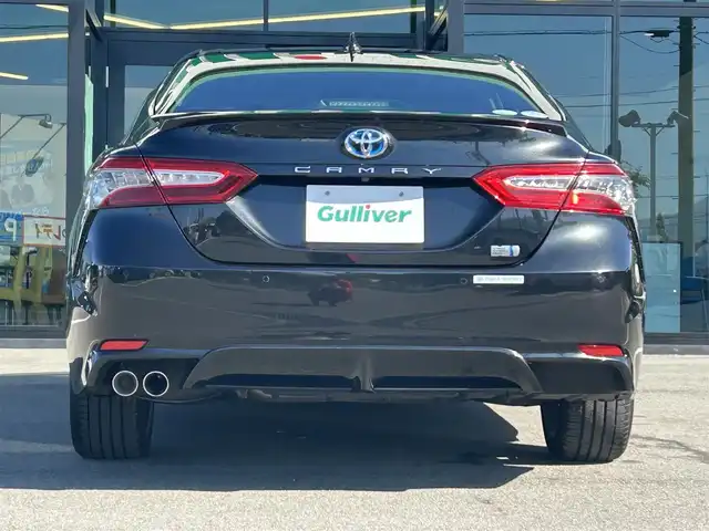 トヨタ カムリ WS ブラックエディション 愛媛県 2020(令2)年 6.8万km プレシャスブラックパール 純正8型ディスプレイオーディオ(フルセグTV/Bluetooth)/バックカメラ/赤レザーシート/前席シートヒーター/パワーシート/トヨタセーフティセンス/衝突被害軽減装置/車線逸脱防止装置/レーダークルーズコントロール/ブラインドスポットモニター/クリアランスソナー/100V/1500Wコンセント/USB入力端子/パドルシフト/ステアリングリモコン/電格ミラー/ヒートミラー/電動パーキングブレーキ/AutoHold機能/シガーソケット/現状サマー(純正AW)(235/45/R18)/DUNLOP LE MANS V＋/禁煙車