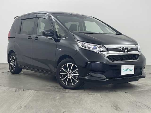 ホンダ フリード ハイブリット G ホンダセンシング 兵庫県 2020(令2)年 5.4万km クリスタルブラックパール ●Honda SENSING/・衝突軽減ブレーキ/・車線逸脱警報/・誤発進抑制機能/・先行車発進お知らせ/・アダプティブブクルーズコントロール/・純正ナビ＆フルセグ＆BT＆DVD/・バックカメラ/・両側パワースライドドア/・LEDヘッドライト＋LEDアクティブコーナリングライト/・運転席用i-SRSエアバッグシステム＆助手席用i-SRSエアバッグシステム/・オートリトラミラー/・社外15インチアルミホイール/・ビルトインETC/・スマートキー/・プッシュスタート/・純正フロアマット/・横滑り防止装置