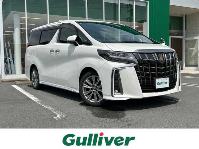 トヨタ アルファード S タイプゴールド 静岡県 2020(令2)年 3.7万km ホワイトパールクリスタルシャイン エンジンスタートボタン/パワーステアリング/パワーウィンドウ/スペアキー/追従走行ありクルーズコントロール/Bluetooth接続/後席用モニター/CDチェンジャー/USB入力端子/純正ETC/バックカメラ/フルセグTV/DVD再生機能ありSDナビ/３列シート/オットマン/電動リアゲート/前方ドライブレコーダー/ウォークスルー/純正フロアマット/ハーフレザーシート/両側パワースライドドア/純正エアロパーツ/純正アルミホイール/ABS/横滑り防止装置/レーンキープアシスト/前後コーナーセンサー/オートライト/オートマチックハイビーム/LEDヘッドライト/W+サイドエアバック/衝突軽減システム