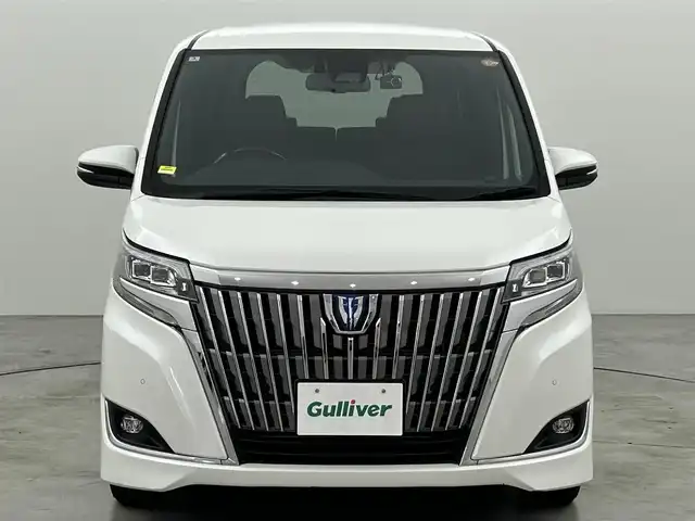 トヨタ エスクァイア ハイブリッド Gi プレミアムパッケージ 福岡県 2020(令2)年 7.6万km ホワイトパールクリスタルシャイン 後席モニター　/純正９型ナビ　/バックカメラ　/ＥＴＣ２．０　/前後ドラレコ　/クルーズコントロール　/衝突被害軽減ブレーキ　/レーンキープ　/ＰＫＳＢ　/ブラウンハーフレザー　/両側電動スライドドア　/シートヒーター