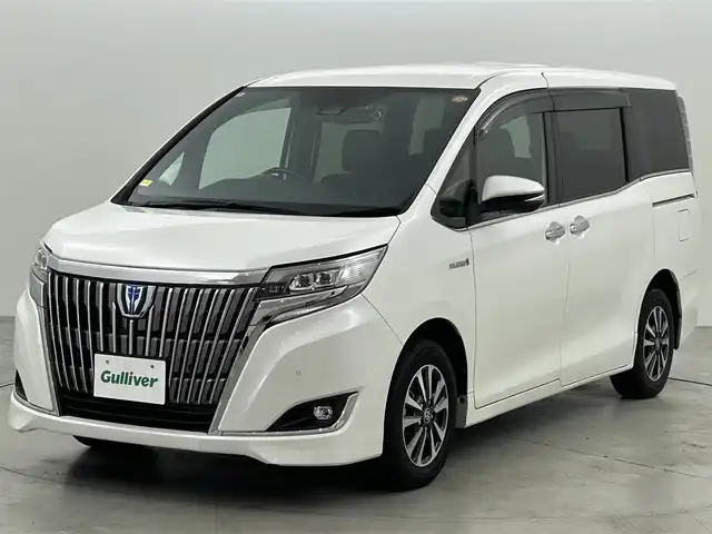 トヨタ エスクァイア ハイブリッド Gi プレミアムパッケージ 福岡県 2020(令2)年 7.6万km ホワイトパールクリスタルシャイン 後席モニター　/純正９型ナビ　/バックカメラ　/ＥＴＣ２．０　/前後ドラレコ　/クルーズコントロール　/衝突被害軽減ブレーキ　/レーンキープ　/ＰＫＳＢ　/ブラウンハーフレザー　/両側電動スライドドア　/シートヒーター
