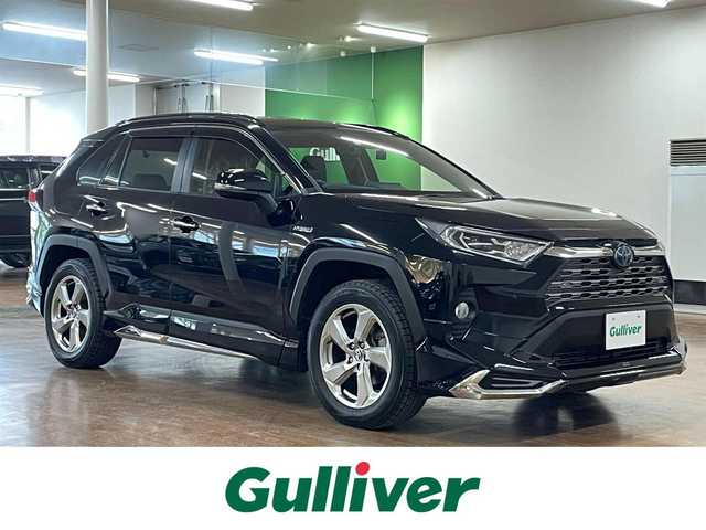 トヨタ ＲＡＶ４ ハイブリッドG 道央・札幌 2020(令2)年 9.4万km アティチュードブラックマイカ 4WD/全周モデリスタエアロ/純正SDナビ/・フルセグTV/CD/DVD/BT/SD/USB/バックカメラ/TVキャンセラー/社外前後ドライブレコーダー/合成皮革シート/前席シートヒーター/運転席パワーシート/運転席シートメモリ機能/電動パーキングブレーキ/ブレーキホールド/パワーバックドア/トヨタセーフティセンス/・プリクラッシュセーフティ/・レーントレーシングアシスト/・ロードサインアシスト/・緊急時操舵支援機能/・低速時加速制御機能/・先行車発進告知機能/横滑り防止装置/前後コーナーセンサー/ステアリングヒーター/レーダークルーズコントロール/ブラインドスポットモニター/ビルトインETC/プッシュスタート/スマートキー/スペアキー/オートライト/オートマチックハイビーム/AC100V電源/純正フロアマット/純正ドアバイザー/ウインカーミラー/ルーフレール/純正18インチAW/ヒッチメンバー/積込社外18インチAW付きサマータイヤ/・225/50R18 ’22製 4mm/新車時保証書/取扱説明書
