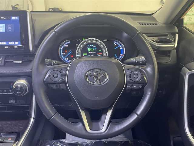 トヨタ ＲＡＶ４ ハイブリッドG 道央・札幌 2020(令2)年 9.4万km アティチュードブラックマイカ 4WD/全周モデリスタエアロ/純正SDナビ/・フルセグTV/CD/DVD/BT/SD/USB/バックカメラ/TVキャンセラー/社外前後ドライブレコーダー/合成皮革シート/前席シートヒーター/運転席パワーシート/運転席シートメモリ機能/電動パーキングブレーキ/ブレーキホールド/パワーバックドア/トヨタセーフティセンス/・プリクラッシュセーフティ/・レーントレーシングアシスト/・ロードサインアシスト/・緊急時操舵支援機能/・低速時加速制御機能/・先行車発進告知機能/横滑り防止装置/前後コーナーセンサー/ステアリングヒーター/レーダークルーズコントロール/ブラインドスポットモニター/ビルトインETC/プッシュスタート/スマートキー/スペアキー/オートライト/オートマチックハイビーム/AC100V電源/純正フロアマット/純正ドアバイザー/ウインカーミラー/ルーフレール/純正18インチAW/ヒッチメンバー/積込社外18インチAW付きサマータイヤ/・225/50R18 ’22製 4mm/新車時保証書/取扱説明書