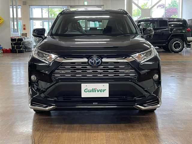 トヨタ ＲＡＶ４ ハイブリッドG 道央・札幌 2020(令2)年 9.4万km アティチュードブラックマイカ 4WD/全周モデリスタエアロ/純正SDナビ/・フルセグTV/CD/DVD/BT/SD/USB/バックカメラ/TVキャンセラー/社外前後ドライブレコーダー/合成皮革シート/前席シートヒーター/運転席パワーシート/運転席シートメモリ機能/電動パーキングブレーキ/ブレーキホールド/パワーバックドア/トヨタセーフティセンス/・プリクラッシュセーフティ/・レーントレーシングアシスト/・ロードサインアシスト/・緊急時操舵支援機能/・低速時加速制御機能/・先行車発進告知機能/横滑り防止装置/前後コーナーセンサー/ステアリングヒーター/レーダークルーズコントロール/ブラインドスポットモニター/ビルトインETC/プッシュスタート/スマートキー/スペアキー/オートライト/オートマチックハイビーム/AC100V電源/純正フロアマット/純正ドアバイザー/ウインカーミラー/ルーフレール/純正18インチAW/ヒッチメンバー/積込社外18インチAW付きサマータイヤ/・225/50R18 ’22製 4mm/新車時保証書/取扱説明書
