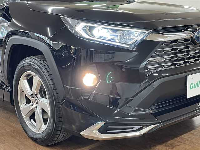トヨタ ＲＡＶ４ ハイブリッドG 道央・札幌 2020(令2)年 9.4万km アティチュードブラックマイカ 4WD/全周モデリスタエアロ/純正SDナビ/・フルセグTV/CD/DVD/BT/SD/USB/バックカメラ/TVキャンセラー/社外前後ドライブレコーダー/合成皮革シート/前席シートヒーター/運転席パワーシート/運転席シートメモリ機能/電動パーキングブレーキ/ブレーキホールド/パワーバックドア/トヨタセーフティセンス/・プリクラッシュセーフティ/・レーントレーシングアシスト/・ロードサインアシスト/・緊急時操舵支援機能/・低速時加速制御機能/・先行車発進告知機能/横滑り防止装置/前後コーナーセンサー/ステアリングヒーター/レーダークルーズコントロール/ブラインドスポットモニター/ビルトインETC/プッシュスタート/スマートキー/スペアキー/オートライト/オートマチックハイビーム/AC100V電源/純正フロアマット/純正ドアバイザー/ウインカーミラー/ルーフレール/純正18インチAW/ヒッチメンバー/積込社外18インチAW付きサマータイヤ/・225/50R18 ’22製 4mm/新車時保証書/取扱説明書