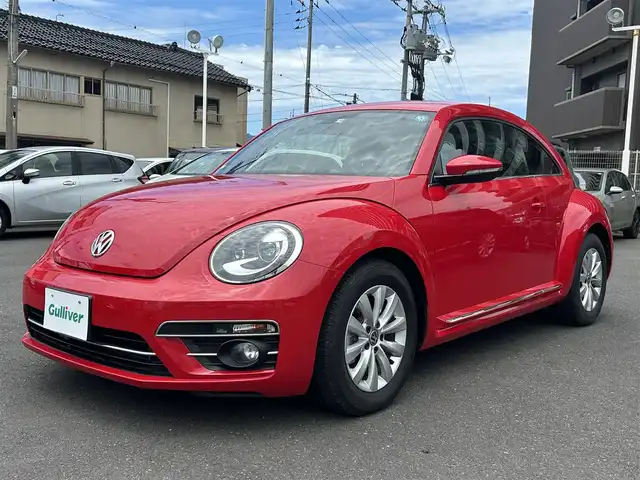 フォルクスワーゲン ザ・ビートル デザイン 島根県 2016(平28)年 3.1万km トルネードレッド 純正SDナビ/Bluetooth/フルセグテレビ/DVD再生/クルーズコントロール/ブラインドスポットディテクション/HIDオートライト/自動防眩ミラー/ミラーヒーター/純正１６インチアルミホイール/純正フロアマット/横滑り防止装置/プッシュスタート