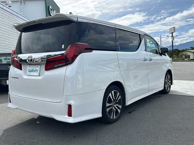 トヨタ アルファード 山梨県 2021(令3)年 3.2万km ホワイトパールクリスタルシャイン 純正ディスプレイオーディオ/BT/フルセグTV/CD/DVD/バックカメラ/フリップダウンモニター/両側パワースライドドア/純正フロアマット/コーナーセンサー前後/純正アルミホイール/前席パワーシート/シートヒーター/シートクーラー/レーダークルーズコントロール/ETC2.0/スマートキー/オットマン/電動リアゲート/レザーシート