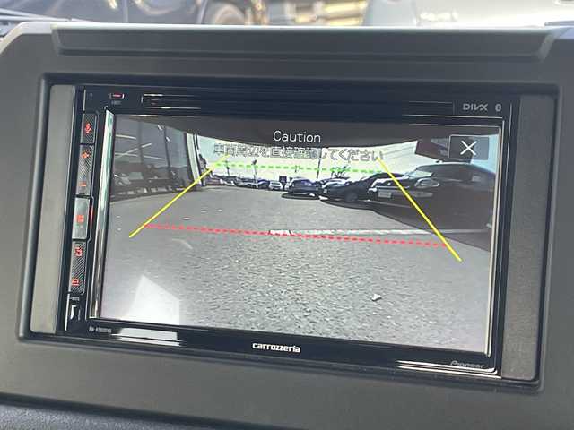 スズキ ジムニー XC 大阪府 2024(令6)年 1.1万km ミディアムグレー ＤＡＭＤグリル/カヤバショックアブソーバー/アピオ16インチアルミホイール/ボンネットダンパー/黒革調シートカバー/ラバーフロアマット/ディスプレイオーディオ/CD/BT/USB/バックカメラ/ドライブレコーダー/衝突軽減システム/レーンキープアシスト/クルーズコントロール/LEDヘッドライト/オートライト/ヒーテッドドアミラー/ヘッドライトウォッシャー/取説/保証書/スペアキーｘ１