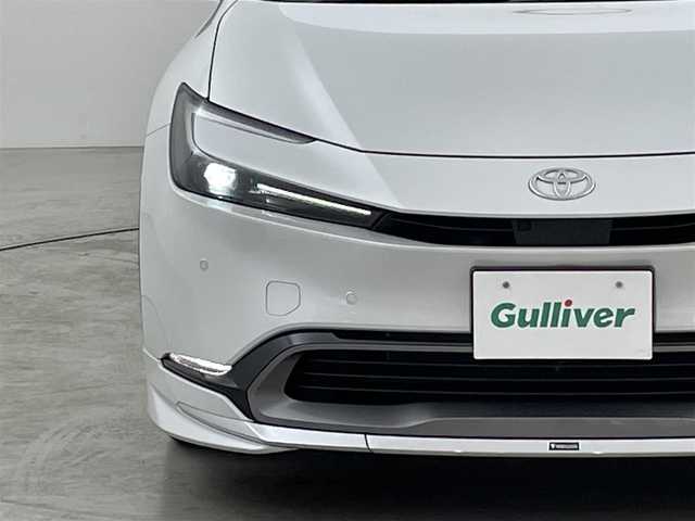 トヨタ プリウス Z 福岡県 2023(令5)年 1.6万km プラチナホワイトパールマイカ ワンオーナー　/モデリスタエアロ　/サンルーフ　/純正ＤＡナビ　/全方位カメラ　/ナビ連動ドラレコ　/ＥＴＣ２．０　/ＡＣＣ　/コーナーセンサー　/ＰＣＳ　/ＬＤＡ　/ＢＳＭ　/ＰＫＳＢ　/パーキングアシスト　/電動リアゲート