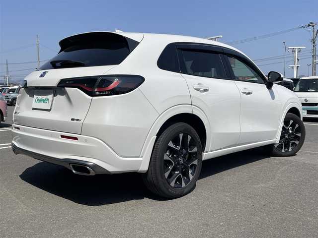 ホンダ ＺＲ－Ｖ ハイブリッド e:HEV Z 徳島県 2023(令5)年 1.1万km プラチナホワイトパール 純正ナビ/追従付きクルーズコントロール/衝突被害軽減ブレーキ/LEDヘッドライト/スマートキー/オートライト/レーンキープアシスト/前後コーナーセンサー/全方位カメラ/BOSEプレミアムサウンドシステム/パワーシート/レザーシート/シートヒーター/デジタルグラフィックメーター/ワイヤレス充電器/オート格納ドアミラー/純正アルミホイール/純正フロアマット