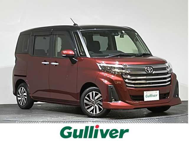 トヨタ ルーミー カスタムG 愛媛県 2022(令4)年 0.4万km ブラックマイカメタリック/ファイアークォーツレッドメタリック 登録時3706km/スマートアシスト/・衝突回避支援ブレーキ/・車線逸脱警報機能/・ブレーキ制御付き誤発進抑制機能/・先行車発進お知らせ機能/・アダプティブドライビングビーム/・アダプティブクルーズコントロール/・衝突警報機能/・ふらつき警報/・サイドビューランプ/・コーナーセンサー/・路側逸脱警報/パノラミックビューモニター/純正SDナビ　/Bluetooth　CD　DVD）　/フルセグTV/ドライブレコーダー　/両側パワースライドドア　/シートヒーター　/ステアリングリモコン　/アイドリングストップ　/LEDヘッドライト　