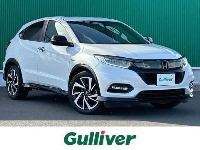 ホンダ ヴェゼル ハイブリッド RS ホンダセンシング 宮城県 2020(令2)年 7.4万km プラチナホワイトパール ホンダセンシング/●衝突軽減ブレーキ〈CMBS〉/●誤発進抑制機能/●歩行者事故低減ステアリング/●路外逸脱抑制機能/●ACC〈アダプティブ・クルーズ・コントロール〉/●LKAS〈車線維持支援システム〉/●先行車発進お知らせ機能/●標識認識機能/純正8インチナビ（VXM-207VFEi）/・CD/DVD/・Bluetooth/・USB/HDMI/・フルセグTV/バックカメラ/ビルトインETC/ドライブレコーダー/コンフォートビューパッケージ/●親水/ヒーテッドドアミラー/●フロントドア撥水ガラス/●熱線入りフロントウインドウ/ハーフレザーシート/シートヒーター/革巻きステアリング/ステアリングスイッチ/パドルシフト/電動パーキングブレーキ/ブレーキホールド/LEDヘッドランプ/フォグランプ/オートライト/スマートキー＆プッシュスタート/純正18インチAW/純正フロアマット/トノカバー/W/サイド/カーテンエアバッグ