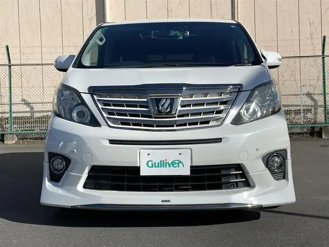 トヨタ アルファード 240S タイプゴールドⅡ 東京都 2014(平26)年 7.7万km ホワイトパールクリスタルシャイン 純正ナビ/純正フリップダウンモニター/バックカメラ/フルセグTV/フロント/リアモデリスタスポイラー/ETC/ツインムーンルーフ/両側電動スライドドア/パワーバックドア/ハーフレザーシート/前方ドライブレコーダー/横滑り防止装置/純正フロアマット/サイドバイザー/クルーズコントロール/スマートキー/オットマン/社外20インチAW