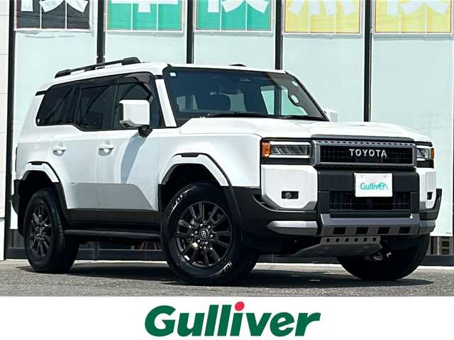 トヨタ ランドクルーザー ２５０ VX 山形県 2024(令6)年 0.2万km プラチナホワイトパールマイカ ４WD/ガソリン車/サポカーS/純正ナビ/（AM/FM/フルセグ/BT/Miracast）/モデリスタエアロ/・フロントアンダーガード/・フロントアンダーカバー/・リヤアンダーガーニッシュ/サンルーフ/本革シート/パノラミックビューモニター/純正前後ドライブレコーダー/全車速追従機能付きクルーズコントロール/マルチテレインセレクト（走行支援モード選択）/電動パワーステアリング/パーキングサポートブレーキ/集中ドアロック/デジタルインナーミラー/シートヒーター/エアシート/パワーバックドア/ステアリングスイッチ