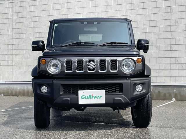 スズキ ジムニー ノマド FC 富山県 2025(令7)年 0.1万km 黒  4WD/ セーフティサポート/・　デュアルカメラブレーキサポート/・　誤発進抑制機能/・　後退時ブレーキサポート/・　後方誤発進抑制機能/・　車線逸脱警報/・　アダプティブクルーズコントロール/・　ハイビームアシスト/・　標識認識機能/・　ふらつき警報/・　先行車発進お知らせ機能/ D/N席シートヒーター/ LEDヘッドライト/・　ヘッドランプウォッシャー/ フォグライト/・　電動オート格納機能/・　ヒーター/ 純正15インチアルミホイール/ 背面タイヤハーフカバー/ 撥水加工ファブリックシート