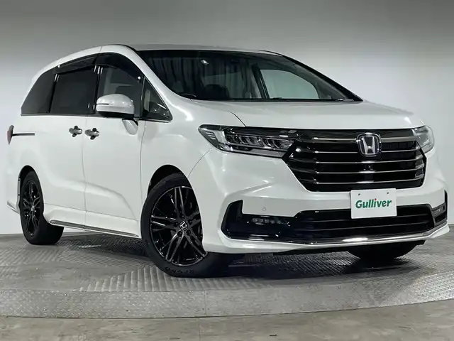 ホンダ オデッセイ ハイブリッド e:HEVアブソルート EX 神奈川県 2020(令2)年 3.2万km プラチナホワイトパール ホンダセンシング/純正10型インターナビゲーション/・BT/フルセグTV/CD/DVD/HDMI/USB/全方位カメラ/純正フリップダウンモニター/センターコンソール/ビルトインETC2.0/両側電動スライドドア/パワーバックドア/コーナーセンサー/純正前後ドライブレコーダー/ECON/ハーフレザーシート/パワーシート(D/N)/シートヒーター(D/N)/革巻きステアリング/ステアリングスイッチ/オートライト/電動サイドブレーキ/オートブレーキホールド/スマートキー/プッシュスタートボタン/LEDヘッドライト/フォグランプ/電動格納ミラー/ウィンカーミラー/純正フロアマット/純正アルミホイール/純正ドアバイザー