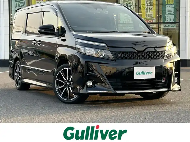 トヨタ ヴォクシー ZS GRスポーツ 岡山県 2019(平31)年 8.8万km ブラック 登録時走行距離87494km/ワンオーナー/ALPINEBIGX9インチナビ/（AM/FM/CD/DVD/TV/BT）/ダブルゾーン/ALPINE12.8インチフリップダウンモニター/両側パワースライドドア/バックカメラ/フロントカメラ/アイドリングストップ/トヨタセーフティセンス/・クルーズコントロール/・オートマチックハイビーム/・プリクラッシュセーフティ/・レーンディパーチャアラート/USB入力端子/HDMI入力端子/純正18インチアルミホイール/LEDヘッドライト/プッシュスタート/スペアタイヤ/取扱説明書/保証書