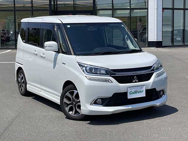 三菱 デリカＤ：２ カスタムHV　MV 青森県 2016(平28)年 12.5万km ピュアホワイトP ・４WD/・社外ナビ/（CD/DVD/フルセグ/Bluetooth）/・バックカメラ/・両側パワースライドドア/・衝突被害軽減システム/・レーンキープアシスト/・クルーズコントロール/・横滑り防止装置/・アイドリングストップ/・ロールサンシェード/・シートバックテーブル/・社外ナビ/（CD/DVD/フルセグ/Bluetooth）/・バックカメラ/・ETC/・オートエアコン/・オートライト/・LEDヘッドライト/・フォグランプ/・純正15インチアルミホイール/・ドアミラーウインカー