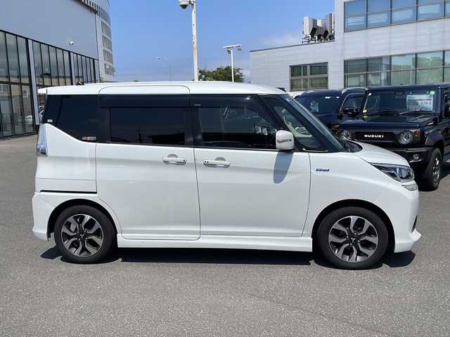 三菱 デリカＤ：２ カスタムHV　MV 青森県 2016(平28)年 12.5万km ピュアホワイトP ・４WD/・社外ナビ/（CD/DVD/フルセグ/Bluetooth）/・バックカメラ/・両側パワースライドドア/・衝突被害軽減システム/・レーンキープアシスト/・クルーズコントロール/・横滑り防止装置/・アイドリングストップ/・ロールサンシェード/・シートバックテーブル/・社外ナビ/（CD/DVD/フルセグ/Bluetooth）/・バックカメラ/・ETC/・オートエアコン/・オートライト/・LEDヘッドライト/・フォグランプ/・純正15インチアルミホイール/・ドアミラーウインカー