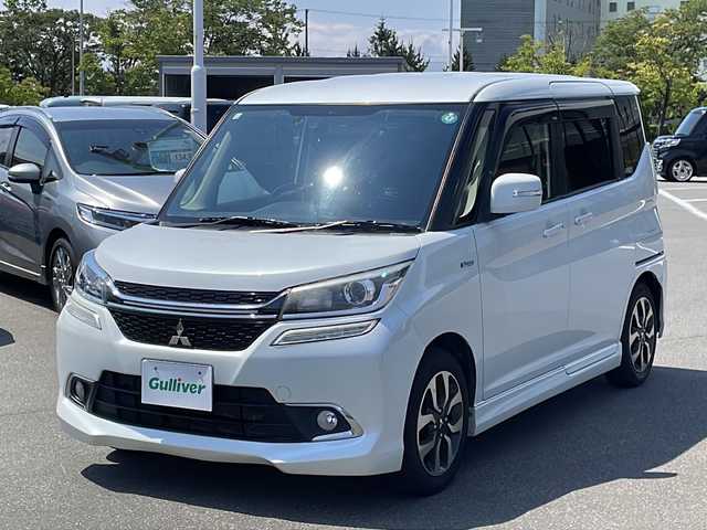 三菱 デリカＤ：２ カスタムHV　MV 青森県 2016(平28)年 12.5万km ピュアホワイトP ・４WD/・社外ナビ/（CD/DVD/フルセグ/Bluetooth）/・バックカメラ/・両側パワースライドドア/・衝突被害軽減システム/・レーンキープアシスト/・クルーズコントロール/・横滑り防止装置/・アイドリングストップ/・ロールサンシェード/・シートバックテーブル/・社外ナビ/（CD/DVD/フルセグ/Bluetooth）/・バックカメラ/・ETC/・オートエアコン/・オートライト/・LEDヘッドライト/・フォグランプ/・純正15インチアルミホイール/・ドアミラーウインカー