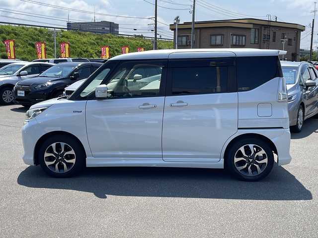 三菱 デリカＤ：２ カスタムHV　MV 青森県 2016(平28)年 12.5万km ピュアホワイトP ・４WD/・社外ナビ/（CD/DVD/フルセグ/Bluetooth）/・バックカメラ/・両側パワースライドドア/・衝突被害軽減システム/・レーンキープアシスト/・クルーズコントロール/・横滑り防止装置/・アイドリングストップ/・ロールサンシェード/・シートバックテーブル/・社外ナビ/（CD/DVD/フルセグ/Bluetooth）/・バックカメラ/・ETC/・オートエアコン/・オートライト/・LEDヘッドライト/・フォグランプ/・純正15インチアルミホイール/・ドアミラーウインカー