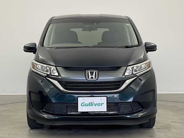 ホンダ フリード G ホンダセンシング 新潟県 2019(平31)年 1.8万km フォレストグリーンパール 純正SDナビ（Bluetooth・CD・DVD・USB）/両側パワースライドドア/純正フリップダウンモニター　/バックカメラ　/フルセグ　/衝突被害軽減システム/レーンキープアシスト　/追従クルーズコントロール　/LEDオートライト　/オートマチックハイビーム　/前方ドライブレコーダー/アイドリングストップ/フロントワイパーデアイサー/ステアリングスイッチ/ETC/純正フロアマット/純正１５インチアルミホイール/スマートキー/スペアキー