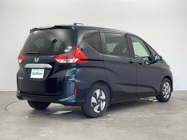 ホンダ フリード G ホンダセンシング 新潟県 2019(平31)年 1.8万km フォレストグリーンパール 純正SDナビ（Bluetooth・CD・DVD・USB）/両側パワースライドドア/純正フリップダウンモニター　/バックカメラ　/フルセグ　/衝突被害軽減システム/レーンキープアシスト　/追従クルーズコントロール　/LEDオートライト　/オートマチックハイビーム　/前方ドライブレコーダー/アイドリングストップ/フロントワイパーデアイサー/ステアリングスイッチ/ETC/純正フロアマット/純正１５インチアルミホイール/スマートキー/スペアキー