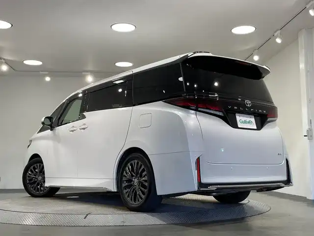 トヨタ ヴェルファイア ハイブリット Z プレミア 愛知県 2024(令6)年 1.4万km プラチナホワイトパールマイカ 純正１４インチディスプレイオーディオ/左右独立ムーンルーフ/純正１３．２型有機ＥＬ後席ディスプレイ/サンセットブラウンプレミアムナッパ本革シート/パノラミックビューモニター/両側パワースライドドア/レーダークルーズコントロール/ワイヤレス充電/ヘッドアップディスプレイ/後席用パワーサイドサンシェード/シートメモリー/シートヒーター＆シートクーラー/ハンドルヒーター/デジタルインナーミラー/前後ドライブレコーダー/ビルトインETC2.0/HDMI＆USB入力端子/パドルシフト/純正フロアマット/純正19インチアルミホイール/プリクラッシュセーフティ/レーンディパーチャーアラート/ブラインドスポットモニター/クリアランスソナー/フロント＆リアクロストラフィックアラート/プロアクティブドライビングアシスト/アドバンストパーク