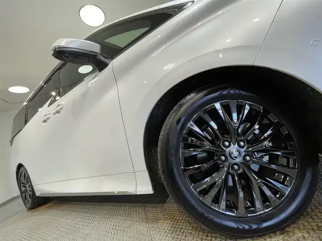 トヨタ ヴェルファイア ハイブリット Z プレミア 愛知県 2024(令6)年 1.4万km プラチナホワイトパールマイカ 純正１４インチディスプレイオーディオ/左右独立ムーンルーフ/純正１３．２型有機ＥＬ後席ディスプレイ/サンセットブラウンプレミアムナッパ本革シート/パノラミックビューモニター/両側パワースライドドア/レーダークルーズコントロール/ワイヤレス充電/ヘッドアップディスプレイ/後席用パワーサイドサンシェード/シートメモリー/シートヒーター＆シートクーラー/ハンドルヒーター/デジタルインナーミラー/前後ドライブレコーダー/ビルトインETC2.0/HDMI＆USB入力端子/パドルシフト/純正フロアマット/純正19インチアルミホイール/プリクラッシュセーフティ/レーンディパーチャーアラート/ブラインドスポットモニター/クリアランスソナー/フロント＆リアクロストラフィックアラート/プロアクティブドライビングアシスト/アドバンストパーク