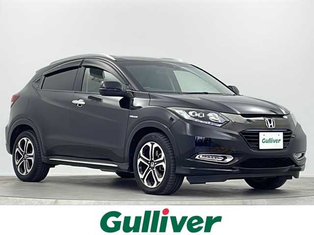 ホンダ ヴェゼル ハイブリッド Z ホンダセンシング 大阪府 2017(平29)年 5.9万km クリスタルブラックパール 純正8型ナビ(フルセグTV/HDMI/USB/CD/DVD)/リンクアップフリー/バックカメラ/ETC/ルーフレール/Honda SENSING/・衝突軽減ブレーキ/・誤発信抑制機能/・歩行者事故低減ステアリング/・路外逸脱抑制機能/・アダブティブ・クルーズ・コントロール/・車線維持支援システム/・先行車発信お知らせ機能/・標識認識機能/オートライト/盗難防止装置/ハーフレザーシート/シートヒーター(D/N席)/純正フロアマット/純正AW/スペアキー/地図カードなし/取扱説明書/保証書