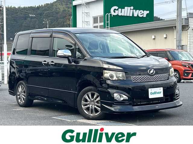 トヨタ ヴォクシー ZS 煌 山口県 2011(平23)年 9万km ブラック ワンオーナー/禁煙車/モデリスタエアロ/(フロント・リアアンダー)/スマートキー/プッシュスタート/フリップダウンモニター/ETC/両側パワースライドドア/純正メモリナビ/(TV/BT/DVD/ラジオ)/バックカメラ/パドルシフト/オートライト/オートエアコン/純正フロアマット/純正アルミホイール/保証書/取扱説明書/記録簿