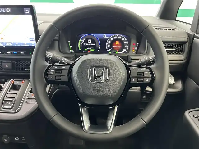 ホンダ ステップワゴン スパーダ eHEV 鹿児島県 2025(令7)年 0.1万km未満 プラチナホワイトパール 登録済未使用車/ホンダセンシング/・衝突軽減ブレーキ/・誤発進抑制機能（前後）/・歩行者事故低減ステアリング/・路外逸脱抑制機能/・渋滞追従機能付アダプティブクルーズコントロール/・車線維持支援システム/・渋滞運転支援機能/・先行車発進お知らせ機能/・標識認識機能/・オートハイビーム/・パーキングセンサーシステム/ブラインドスポットインフォメーション/アダプティブドライビングビーム/純正11インチメモリナビ【LXM-247VFLi】/（CD/DVD/フルセグ/Bluetooth/SD/USB）/バックカメラ/ハーフレザーシート/前席シートヒーター/2列目オットマン/全列USBチャージャー/革巻きステアリング/ステアリングリモコン/パドルシフト/電動パーキングブレーキ/ブレーキホールド/純正LEDヘッドライト/フロントフォグランプ/オートライト/ヘッドライトレベライザー/純正16インチアルミ/保証書&取扱説明書