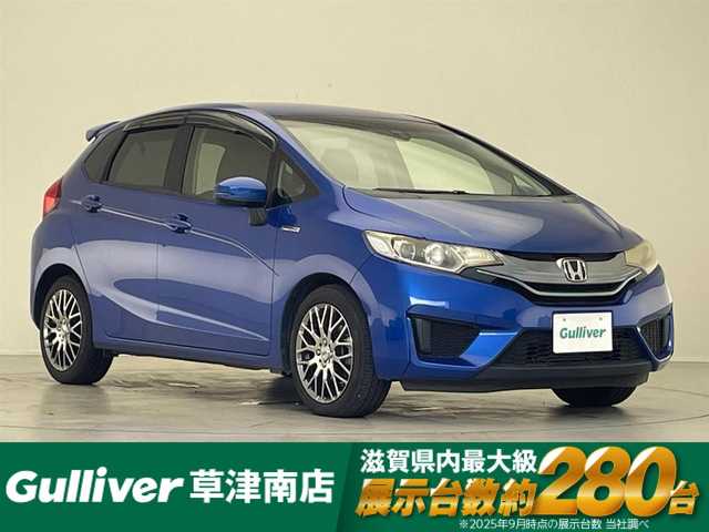 ホンダ フィット ハイブリット Lパッケージ 滋賀県 2013(平25)年 4.1万km ブリリアントスポーティブルーメタリック2トーン 純正ナビ　Bluetooth/CD/DVD/USB/HDMI/バックカメラ/クルーズコントロール/LEDヘッドライト/ビルトインETC/ドライブレコーダー（前方）/ステアリングスイッチ/ハーフレザーシート/合皮シートカバー/ドアバイザー/プッシュスタート/スマートキー/純正フロアマット