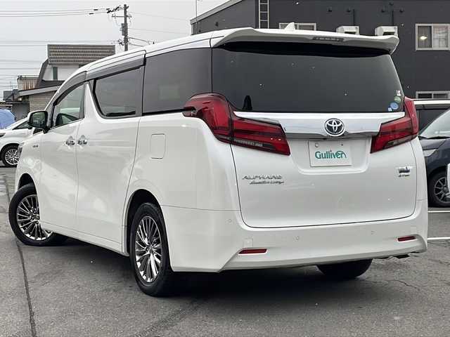 トヨタ アルファードハイブリット エグゼクティブ ラウンジ 道北・旭川 2019(令1)年 5.7万km ホワイトパールクリスタルシャイン /4WD//禁煙車//JBLサウンド//純正SDナビ//CD/DVD/BD/SD/MSV/BT/AUX/USB/フルセグ//パノラミックビューモニター//12.1型リアエンターテイメントシステム//ベージュ革シート//運転席メモリシート//パワーシート//１・2列目シートヒーター//１・2列目エアシート//両側パワースライドドア//パワーバックドア//トヨタセーフティセンス//PCS/ACC/LTA/BSM/RCTA/PKSB/RSA//クリアランスソナー//デジタルインナーミラー//１５００Wコンセント//ステアリングヒーター//純正ドライブレコーダー//ビルトインETC2.0//オートハイビーム//オートライト//3眼LEDヘッドライト//フォグライト//オートリトラミラー//オートワイパー//サンシェード//純正フロアマット//ドアバイザー