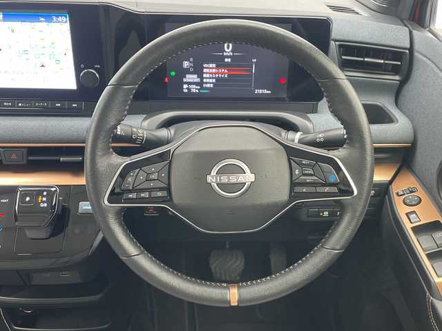 日産 サクラ G 愛知県 2023(令5)年 2.2万km スパークリングレッド/ブラック 純正9型ディスプレイオーディオナビ/全方位カメラ/プロパイロット/レーダークルーズコントロール/シートヒーター/バックカメラ/コーナーセンサー/純正アルミホイール/ETC2.0/インテリジェントミラー/LEDヘッドライト/ステアリングヒーター/レーンキープアシスト/オートマチックハイビーム/ドライブレコーダー/ステアリングスイッチ/スマートキー/プッシュスタート