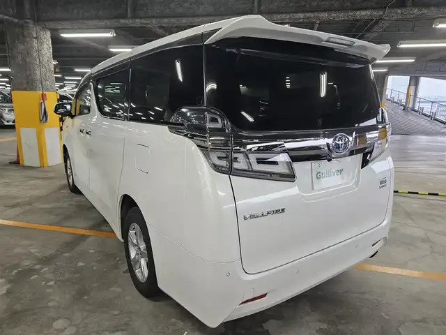 トヨタ ヴェルファイア ハイブリット X 福岡県 2018(平30)年 7.8万km ホワイトパールクリスタルシャイン 4WD/純正10型ナビ/フルセグTV/両側パワースライドドア/バックカメラ/ビルトインETC2.0/デジタルインナーミラー/ドライブレコーダー/レーダークルーズコントロール/クリアランスソナー/セーフティセンス/・衝突被害軽減ブレーキ/・車線逸脱防止支援システム/・交通標識認識システム/・オートマチックハイビーム/2眼LEDヘッドランプ/デュアルオートエアコン/革巻きステアリング/ベージュファブリックシート/2列目チップアップシート/純正16インチAWスタッドレス/スマートキー/プッシュエンジンスタート/禁煙車