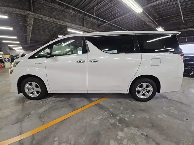 トヨタ ヴェルファイア ハイブリット X 福岡県 2018(平30)年 7.8万km ホワイトパールクリスタルシャイン 4WD/純正10型ナビ/フルセグTV/両側パワースライドドア/バックカメラ/ビルトインETC2.0/デジタルインナーミラー/ドライブレコーダー/レーダークルーズコントロール/クリアランスソナー/セーフティセンス/・衝突被害軽減ブレーキ/・車線逸脱防止支援システム/・交通標識認識システム/・オートマチックハイビーム/2眼LEDヘッドランプ/デュアルオートエアコン/革巻きステアリング/ベージュファブリックシート/2列目チップアップシート/純正16インチAWスタッドレス/スマートキー/プッシュエンジンスタート/禁煙車