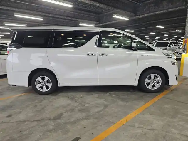 トヨタ ヴェルファイア ハイブリット X 福岡県 2018(平30)年 7.8万km ホワイトパールクリスタルシャイン 4WD/純正10型ナビ/フルセグTV/両側パワースライドドア/バックカメラ/ビルトインETC2.0/デジタルインナーミラー/ドライブレコーダー/レーダークルーズコントロール/クリアランスソナー/セーフティセンス/・衝突被害軽減ブレーキ/・車線逸脱防止支援システム/・交通標識認識システム/・オートマチックハイビーム/2眼LEDヘッドランプ/デュアルオートエアコン/革巻きステアリング/ベージュファブリックシート/2列目チップアップシート/純正16インチAWスタッドレス/スマートキー/プッシュエンジンスタート/禁煙車