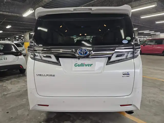 トヨタ ヴェルファイア ハイブリット X 福岡県 2018(平30)年 7.8万km ホワイトパールクリスタルシャイン 4WD/純正10型ナビ/フルセグTV/両側パワースライドドア/バックカメラ/ビルトインETC2.0/デジタルインナーミラー/ドライブレコーダー/レーダークルーズコントロール/クリアランスソナー/セーフティセンス/・衝突被害軽減ブレーキ/・車線逸脱防止支援システム/・交通標識認識システム/・オートマチックハイビーム/2眼LEDヘッドランプ/デュアルオートエアコン/革巻きステアリング/ベージュファブリックシート/2列目チップアップシート/純正16インチAWスタッドレス/スマートキー/プッシュエンジンスタート/禁煙車