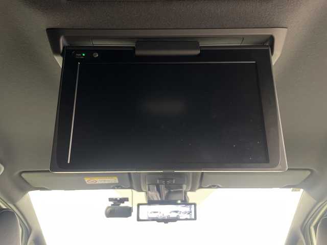 トヨタ ヴォクシー ハイブリッド ZS 煌Ⅲ 埼玉県 2021(令3)年 2.6万km ホワイトパールクリスタルシャイン フリップダウンモニター　/純正ナビ　/ビルトインＥＴＣ２．０　/両側パワースライドドア　/デジタルインナーミラー　/バックカメラ/シートヒーター/クルーズコントロール/レーンキープアシスト　/衝突軽減ブレーキ　/横滑り防止措置　/ドライブレコーダー/純正ホイール/LEDヘッドライト/フォグランプ/ロールサンシェード