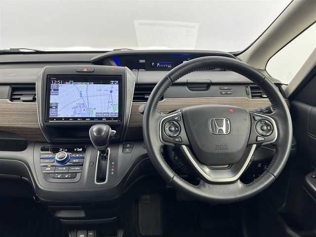 ホンダ フリード クロスター ホンダセンシング 愛知県 2021(令3)年 3.5万km スーパープラチナグレーメタリック ホンダセンシング/　　・衝突軽減ブレーキシステム/　　・歩行者事故低減ステアリング/　　・路外逸脱抑制機能/　　・アダプティブクルーズコントロール/　　・車線維持支援システム/　　・誤発信抑制機能/　　・先行車発進お知らせ機能/　　・標識認識機能/純正9インチインターナビ/　　・CD/DVD/フルセグ/Bluetooth/両側パワースライドドア/寒冷地仕様/ワイパーデアイサー/バックカメラ/ETC/本革巻ステアリングリモコン/ハーフレザーシート/シートヒーター（前席）/キャプテンシート/ロールサンシェード/純正LEDヘッドライト/フォグランプ/純正15インチアルミホイール/取扱説明書/保証書/スペアキー