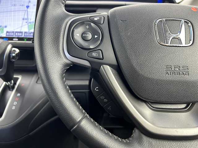 ホンダ フリード クロスター ホンダセンシング 愛知県 2021(令3)年 3.5万km スーパープラチナグレーメタリック ホンダセンシング/　　・衝突軽減ブレーキシステム/　　・歩行者事故低減ステアリング/　　・路外逸脱抑制機能/　　・アダプティブクルーズコントロール/　　・車線維持支援システム/　　・誤発信抑制機能/　　・先行車発進お知らせ機能/　　・標識認識機能/純正9インチインターナビ/　　・CD/DVD/フルセグ/Bluetooth/両側パワースライドドア/寒冷地仕様/ワイパーデアイサー/バックカメラ/ETC/本革巻ステアリングリモコン/ハーフレザーシート/シートヒーター（前席）/キャプテンシート/ロールサンシェード/純正LEDヘッドライト/フォグランプ/純正15インチアルミホイール/取扱説明書/保証書/スペアキー