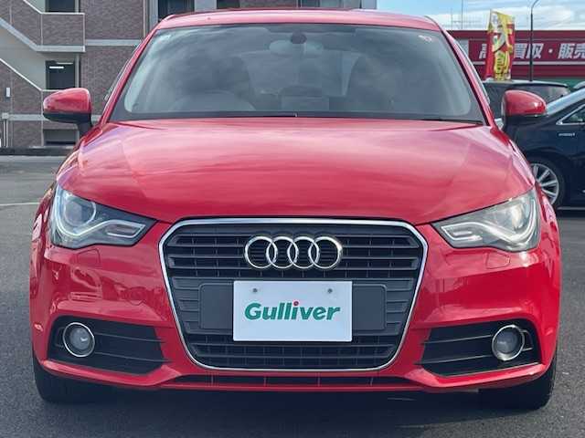 アウディ Ａ１ スポーツバック 1．4TFSI 静岡県 2014(平26)年 4.3万km 赤 純正ナビ/（AM/FM/ワンセグTV/Bluetooth/CD）/MTモード付AT/純正15inAW/キセノンヘッドライト/ETC/横滑り防止機能/オートライト/電動格納ミラー/ステアリングスイッチ/純正フロアマット/スマートキー/プッシュスタート/スペアキー1/保証証/取扱説明書