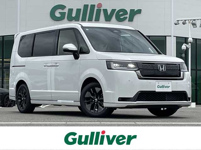 ホンダ ステップワゴン スパーダ eHEV 佐賀県 2025(令7)年 0.1万km未満 プラチナホワイトパール 登録済未使用車「登録時走行距離3km」/ホンダセンシング/衝突軽減ブレーキ/誤発進抑制機能/路外逸脱抑制機能/車線維持支援システム(LKAS)/渋滞追従機能付アダプティブクルーズコントロール/先行車発進お知らせ機能/標識認識機能/LEDオートハイビーム/アダプティブドライビングビーム/ブラインドスポットインフォメーション/11.4インチHonda CONNECTナビ「LXM247VFLi」/AM/FM/Bluetooth/フルセグ/CD/DVD/Apple Car Play/Andoroid Auto//両側パワースライドドア/パワーテールゲート/シートヒーター「運転席/助手席」/後席テーブル/後席サンシェード/オットマン/スマートキー×2