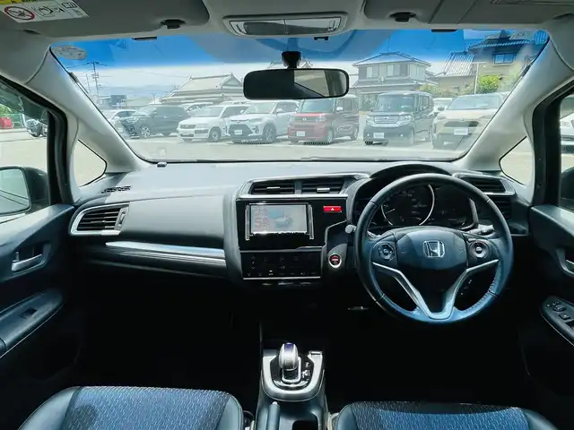 ホンダ フィット ハイブリット Lパッケージ 熊本県 2014(平26)年 15.5万km クリスタルブラックパール 社外ナビ（NX614）/・AM/FM/CD/DVD/BT/SD/・フルセグTV/・バックカメラ/ＥＴＣ/横滑り防止装置/クルーズコントロール/革巻きステアリング/ステアリングスイッチ/オートライト/ハーフレザーシート/純正フロアマット/ドアバイザー/電動格納ミラー/・ウインカーミラー/純正アルミホイール