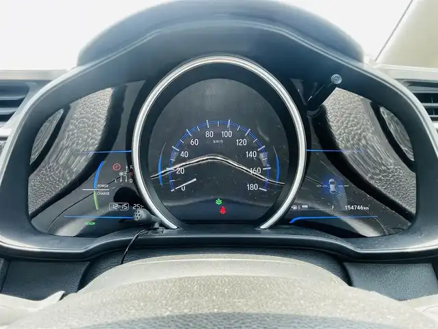 ホンダ フィット ハイブリット Lパッケージ 熊本県 2014(平26)年 15.5万km クリスタルブラックパール 社外ナビ（NX614）/・AM/FM/CD/DVD/BT/SD/・フルセグTV/・バックカメラ/ＥＴＣ/横滑り防止装置/クルーズコントロール/革巻きステアリング/ステアリングスイッチ/オートライト/ハーフレザーシート/純正フロアマット/ドアバイザー/電動格納ミラー/・ウインカーミラー/純正アルミホイール